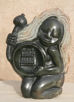 Engrossed Musician Playing an Mbira